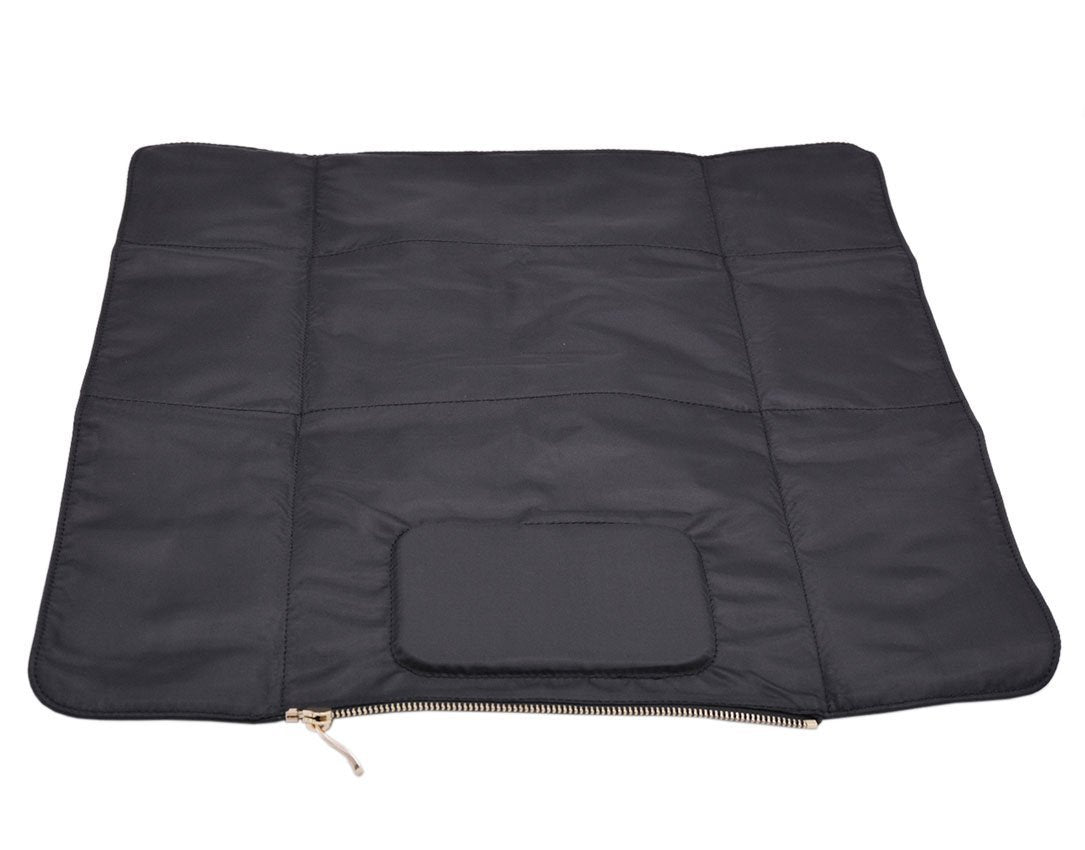 Black Indigo Nappy Changing Clutch change mat detached from the rest of the clutch. Features padded head rest and gold hardware.